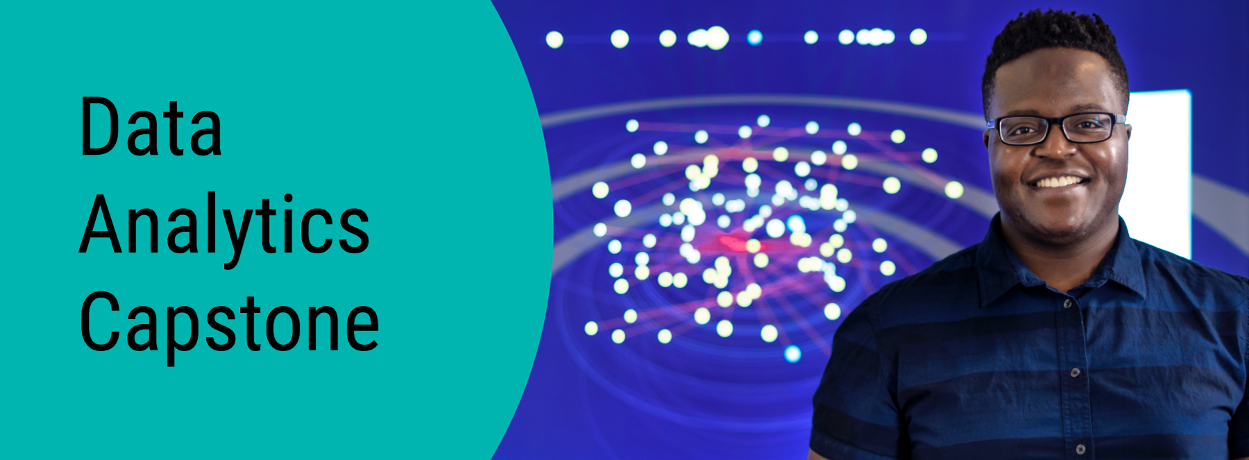Data Analytics Capstone. A student standing in front of a large data visualization. 