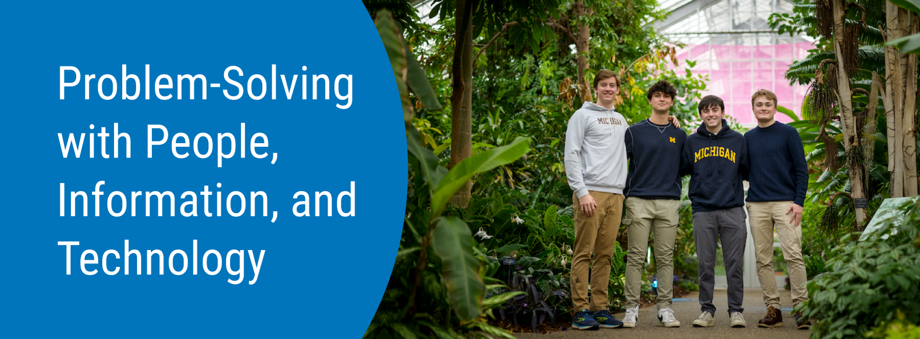 Problem-Solving with People, Information and Technology. Four students posing together in a greenhouse.