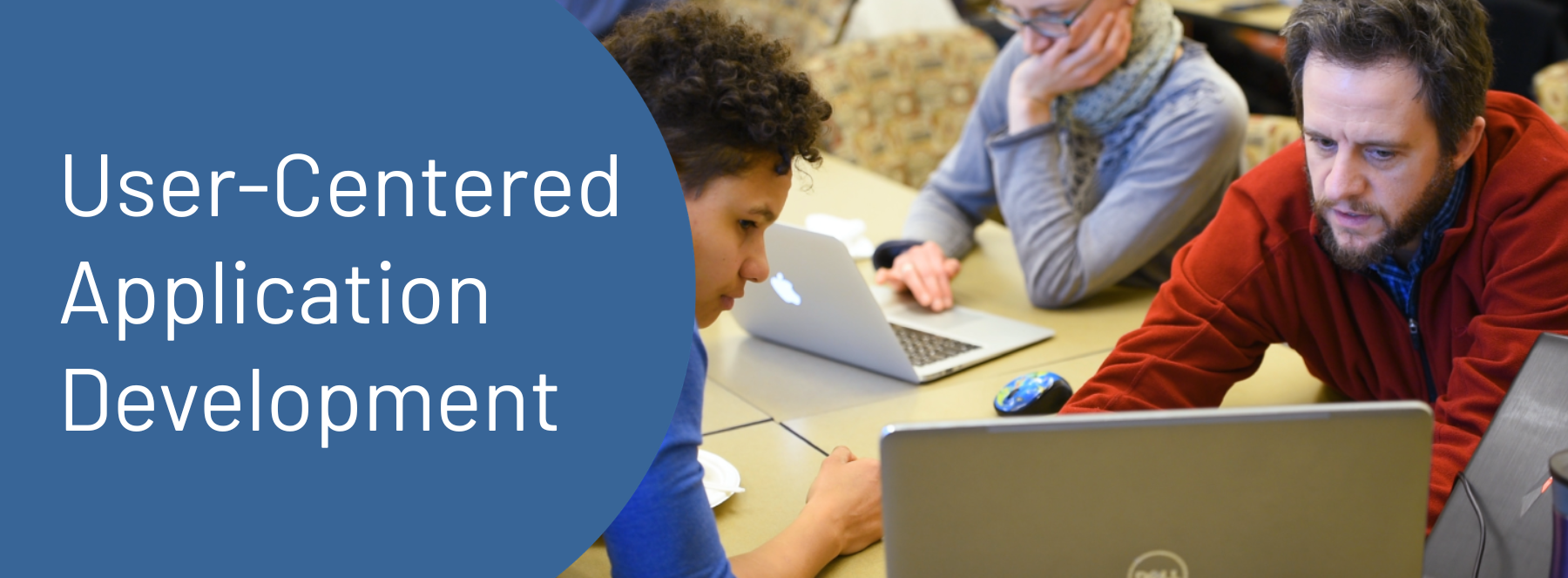 User-Centered Application Development. A person showing a child something on a laptop screen