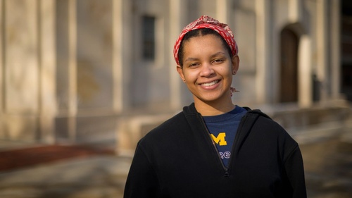 Christine poses outside near the UM bell tower