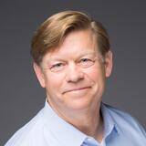A headshot of John Thompson
