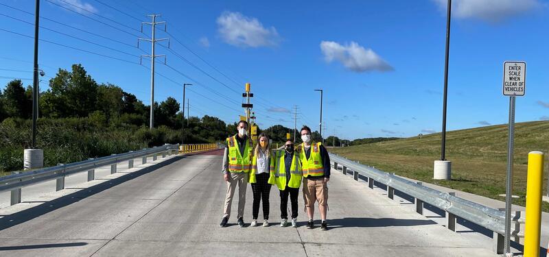 Students stand on the weighing platform at Ann Arbors compost facility