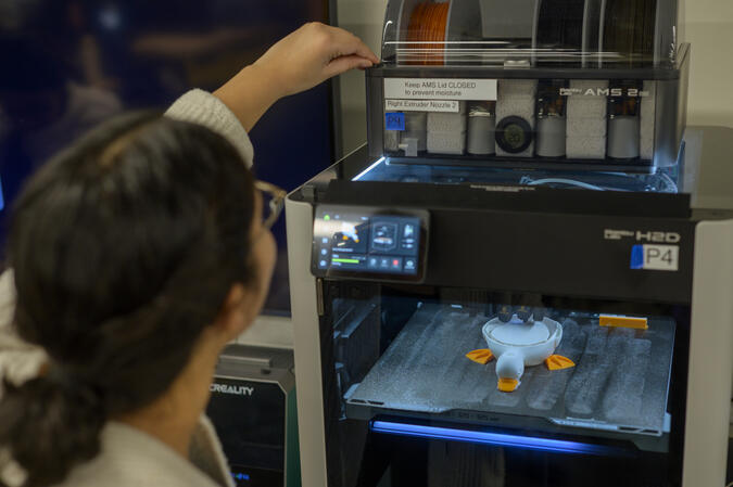 A student using a 3D printer