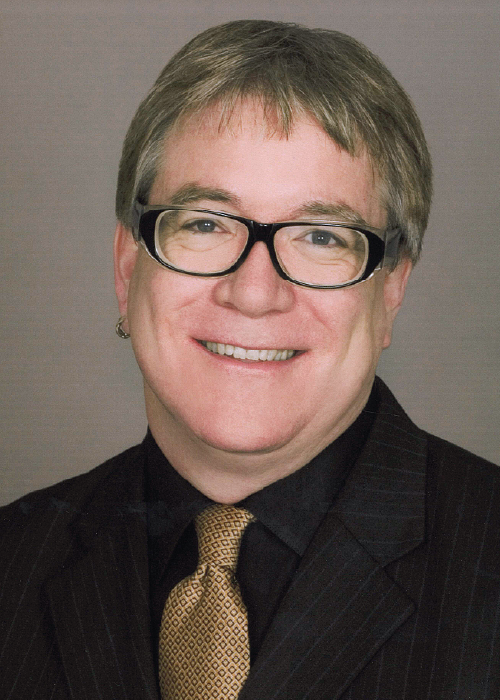 A headshot of Jeffrey K. MacKie-Mason