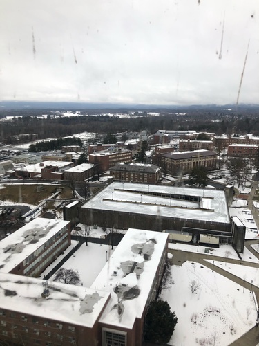 Aerial photo of snow-capped buildings on the University of Massachusetts Amherst campus.