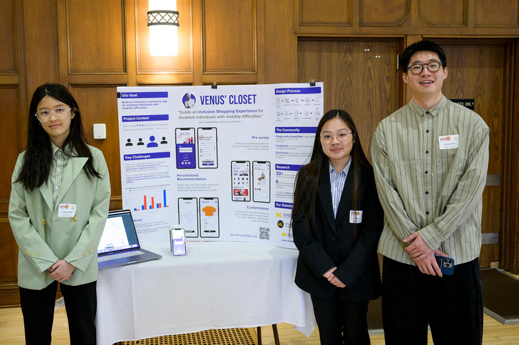 UMSI students Jingting Wang, Vivian Le and Jianxuan Xu pose with the poster board for their project at the 2023 UMSI Student Project Exposition. The project board is titled “Venus’ Closet.” 