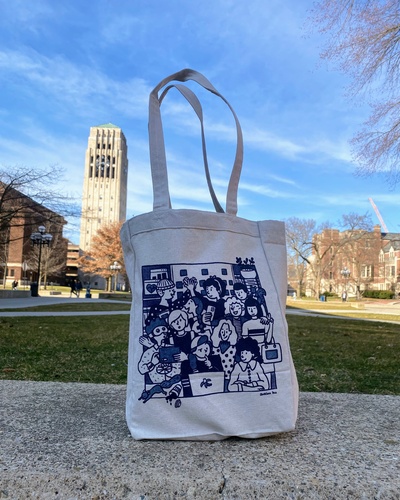 A photo of the front of the tote bag designed by Avalon Hu, with the Burton Memorial Tower visible in the background