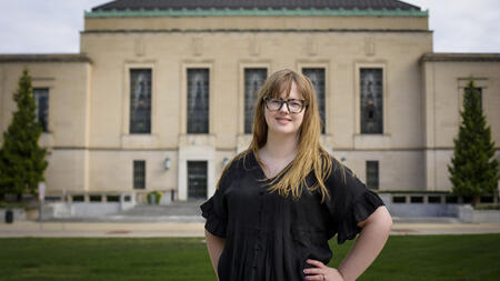 A photo of Elizabeth Whittaker in front of a building 