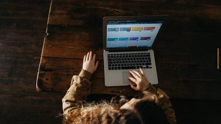 Overhead shot of a young person using a computer