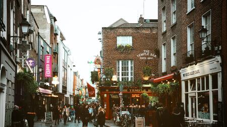 Temple Bar, Ireland, a busy street spread over cobbled pedestrian lanes. 