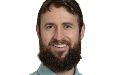 Garret Potter smiling on white background.