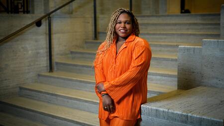 Chelsea poses in Rackham wearing orange