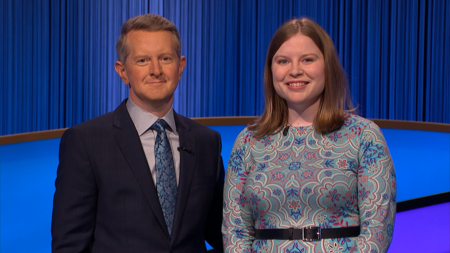 A photo of Adriana Harmeyer posing with Jeopardy! host Ken Jennings