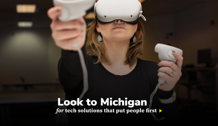 A person wearing a VR headset. Look to Michigan for tech solutions that put people first 
