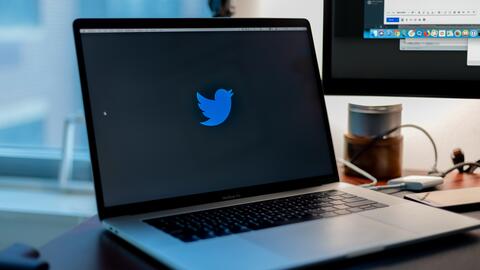 Photo of a laptop displaying the Twitter logo