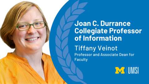 Tiffany Veinot, professor and associate dean for faculty, is appointed Joan C. Durrance Collegiate Professor of Information. Veinot is pictured in an orange shirt and glasses. She is smiling. 