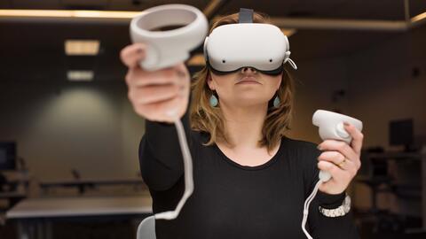Chloe wears a VR headset