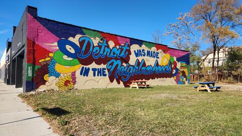 A colorful mural at the corner of Monica Street and McNichols in Detroit that reads "Detroit was made in the neighborhoods." 