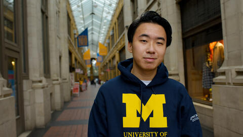 Vincent Wei stands in Nickels Arcade in downtown Ann Arbor
