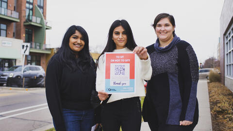 Students pose in downtown Ferndale with a QR code
