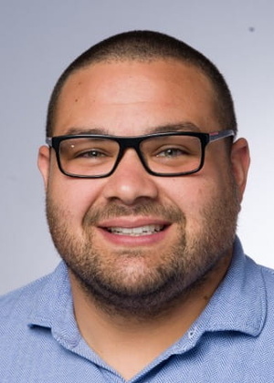 A headshot of Steven De La Torre
