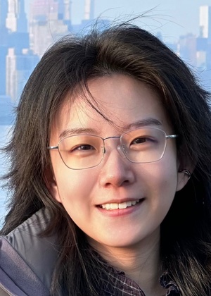 A headshot of Yutong Xie with a city skyline and water in the background.