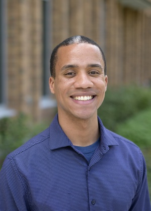 A headshot of Ejike Anusiem