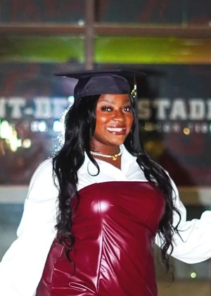 A headshot of Myranda Bell wearing a graduation cap.