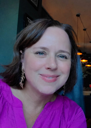A headshot of Laura Koroncey