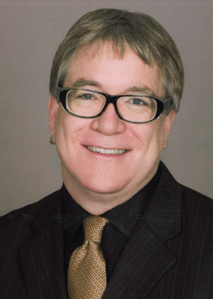 A headshot of Jeffrey K. MacKie-Mason
