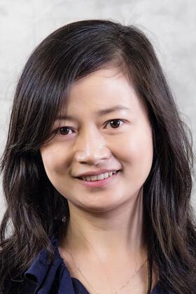 A headshot of Yunyao Li against a light gray background