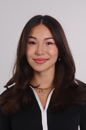 A headshot of Shalin Zarboulas against a white backdrop