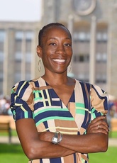 Valeda Dent stands in front of an Emory University campus building